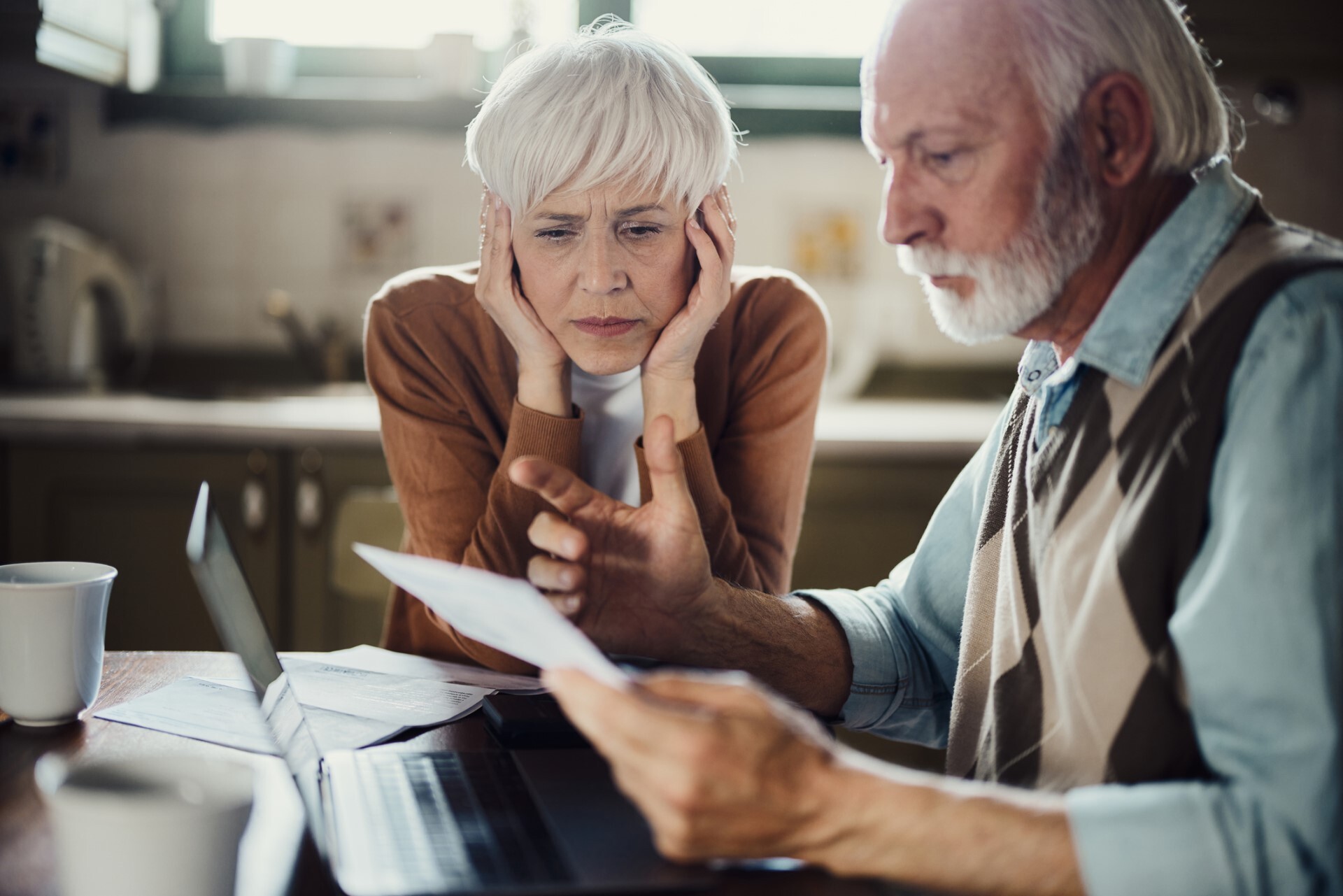Senior couple working on bills